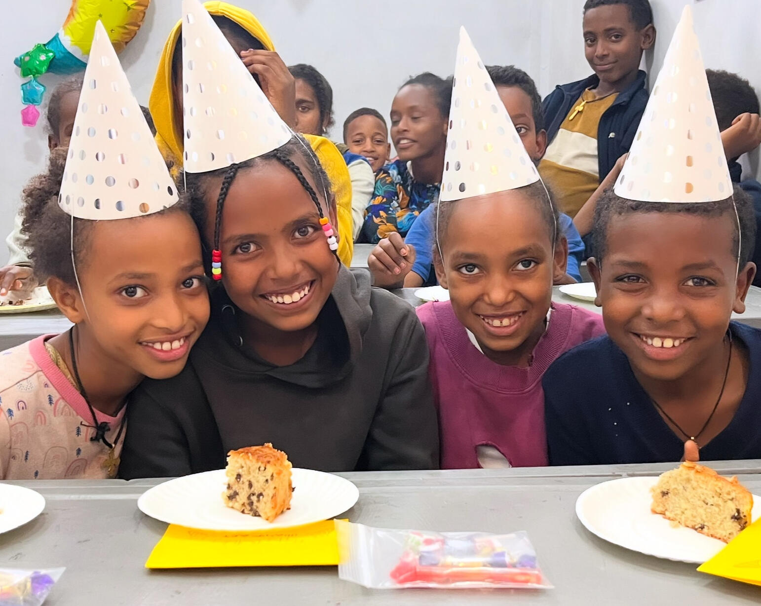 Ethiopian children celebrating a birthday at Glimmer for All private school.